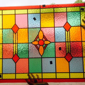 A stained glass window with lead detail