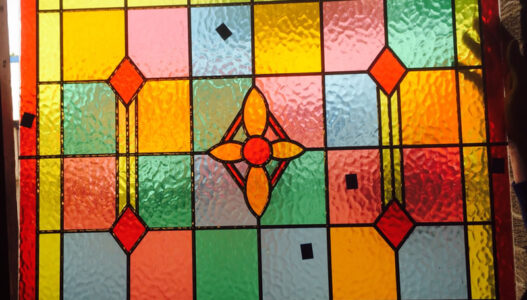 A stained glass window with lead detail