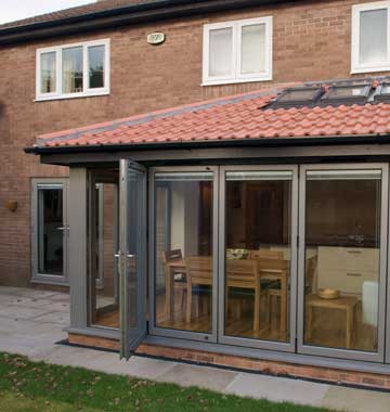 Grey aluminium bifolds with one door open