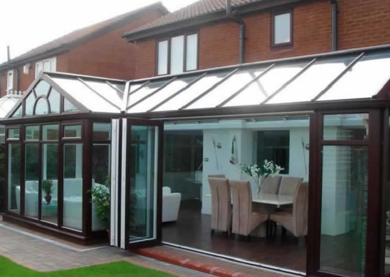 rosewood conservatory with bi-folding doors in Yorkshire